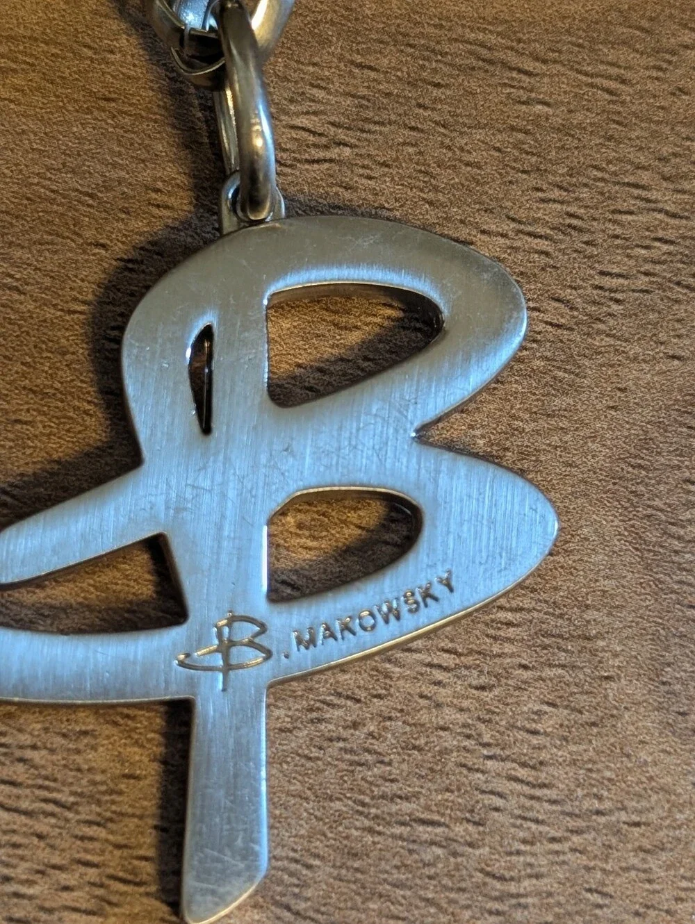 B. Makowsky silver-tone bag charm keychain FOB